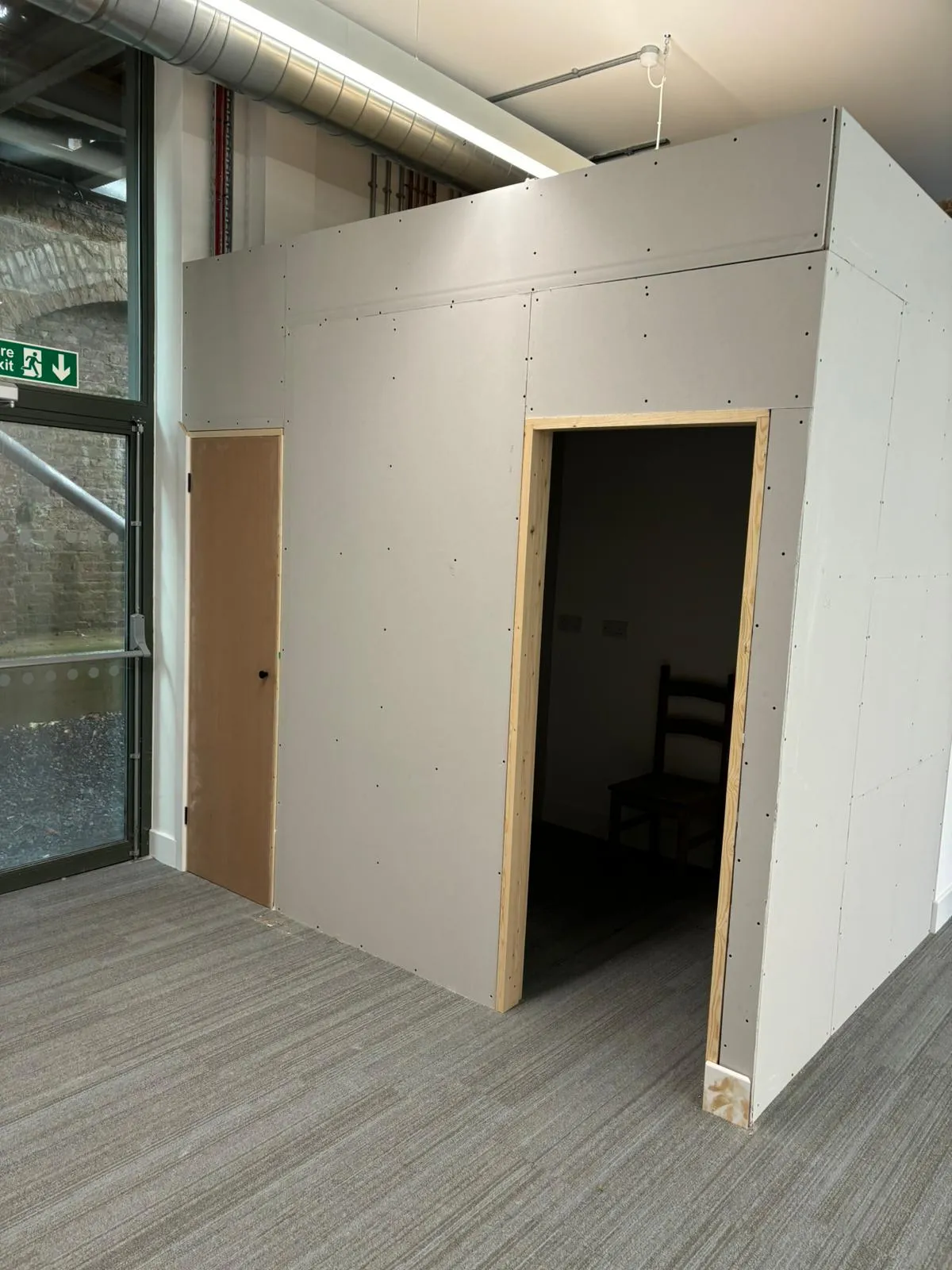 Partitioned office pod under construction inside a commercial unit